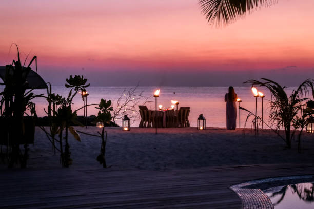istock Romantic Maldivian Sunset Beach Dinner with candlelight 1216946851