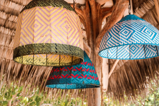 Bohemian Lamps hanging from tropical driftwood roof