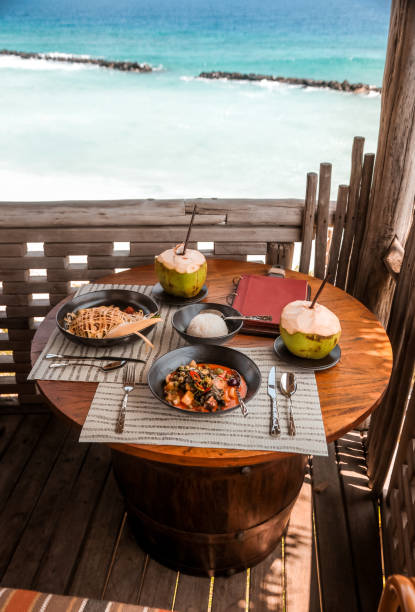 istock Tropical Lunch Table by the Sea 1216947879