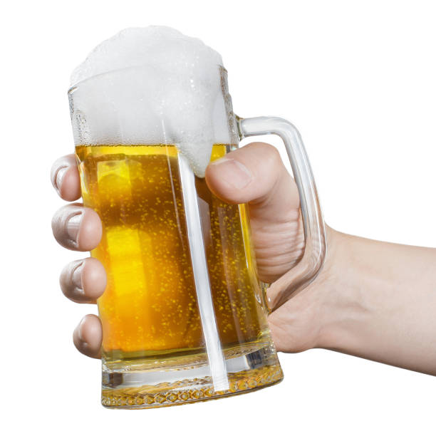 istock Male hand with beer glass on white 1216947958