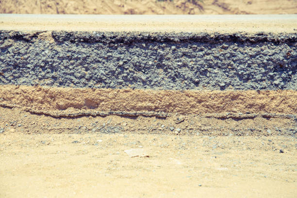 Asphalt road damage and repair work.