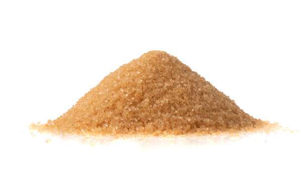 istock Raw Brown Cane Sugar Isolated on White Background 1216952581
