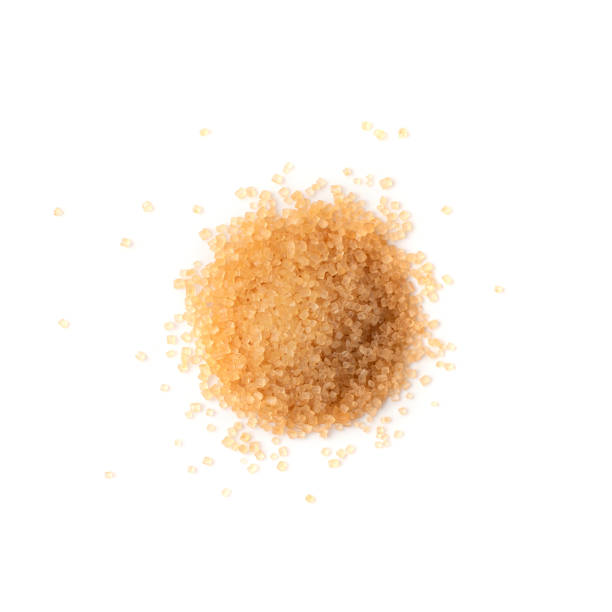 istock Raw Brown Cane Sugar Isolated on White Background 1216952583