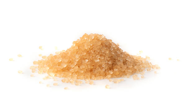 istock Raw Brown Cane Sugar Isolated on White Background 1216952590