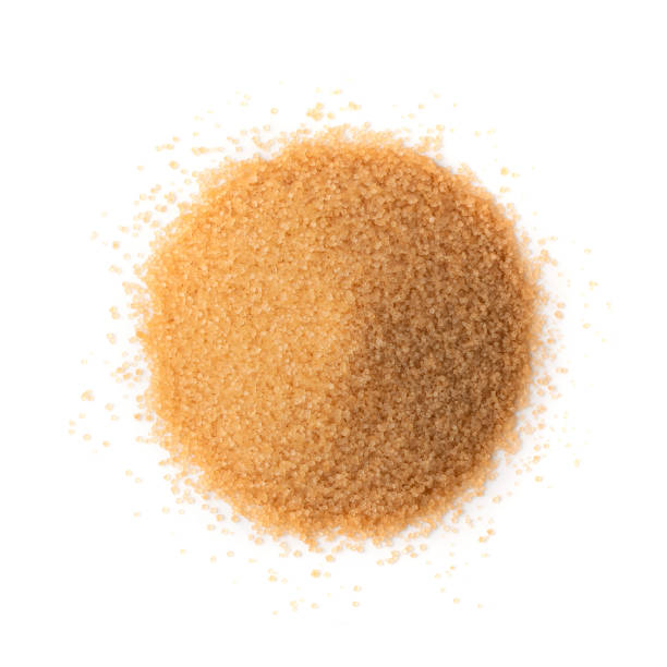 istock Raw Brown Cane Sugar Isolated on White Background 1216952597
