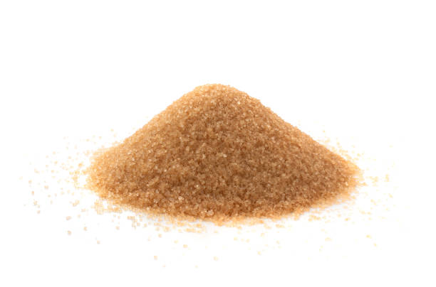 istock Raw Brown Cane Sugar Isolated on White Background 1216952604