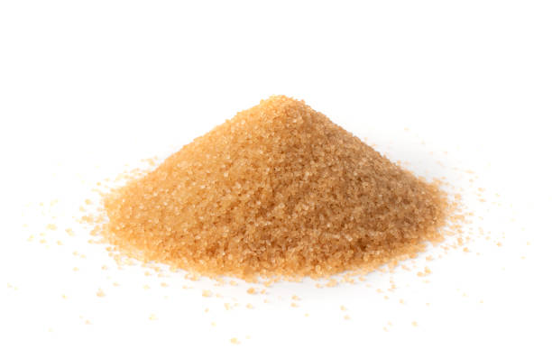istock Raw Brown Cane Sugar Isolated on White Background 1216952635