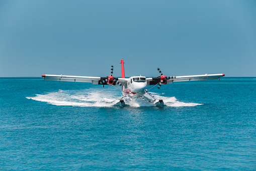 Twinotter Seaplane landing in Maldives lagoon