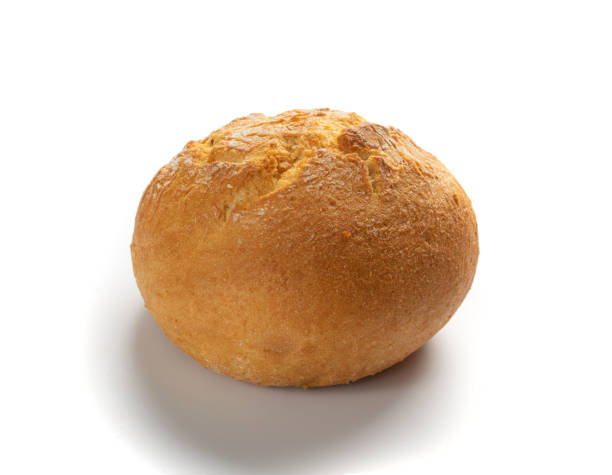 istock One Round Golden Bun Isolated on White Background 1216953406
