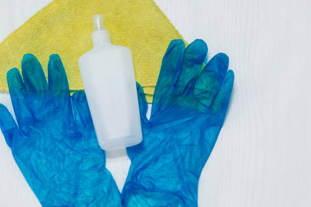 istock Sanitizer, rag and cleaning gloves 1216953688