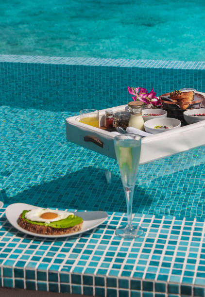 istock Luxurious Floating Breakfast tray in Swimming Pool by the sea 1216953906