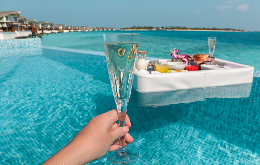 Enjoying a floating breakfast in Maldives Water Villa Pool