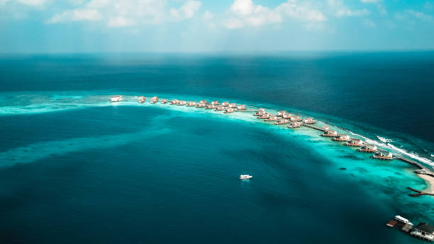 istock Maldives Island Lagoon with Water Villas 1216953980