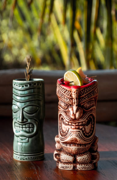 istock Two Tiki Cocktail Mugs with fruit 1216953985