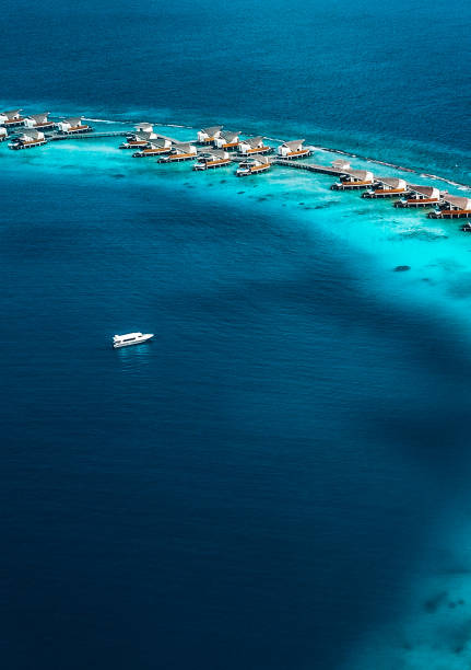 istock Maldives Island Lagoon with Water Villas 1216953986