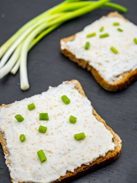istock fish roe paste spread on bread slices and green onion on slate breakfast snack concept 1216954747