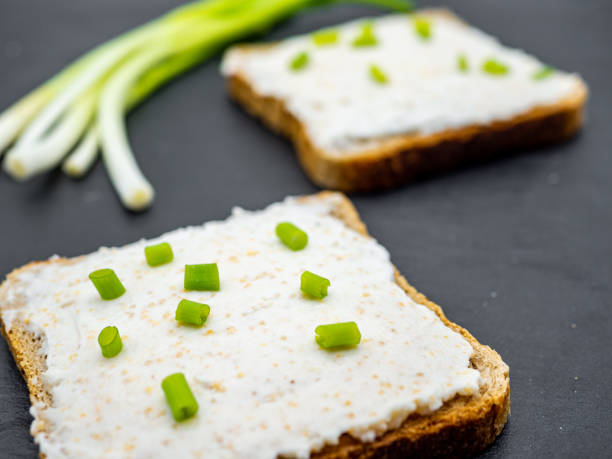 istock fish roe paste spread on bread slices and green onion on slate breakfast snack concept 1216954798