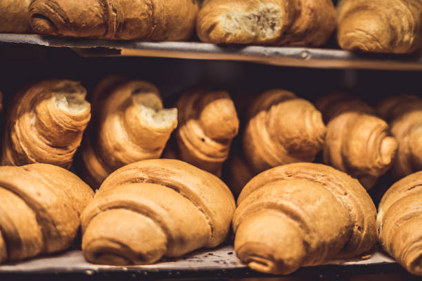 istock French Croissants on a showcase in a bakery shop 1216954930