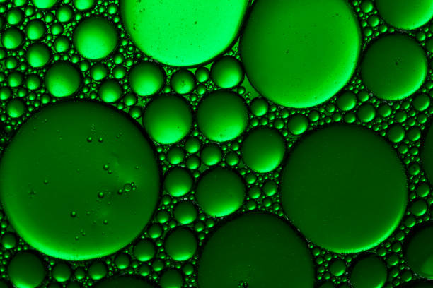 istock Abstract Green water bubbles background. Green Water Drops Background 1216958336
