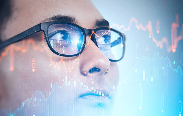 istock Asian investor in glasses, financial graph 1216959488