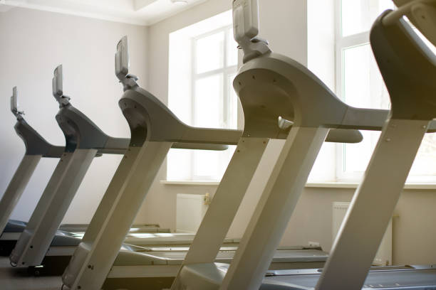 istock gym cardio equipment in a sunny day 1216959492