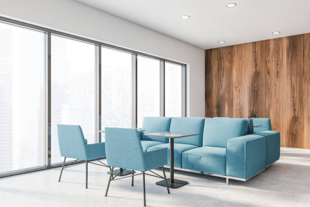 istock White and wooden office lounge corner, blue sofas 1216960899