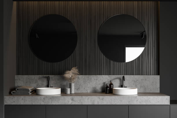 istock Gray and wooden bathroom, double sink close up 1216961028