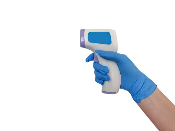 istock hand in medical glove with thermometer isolated 1216961056