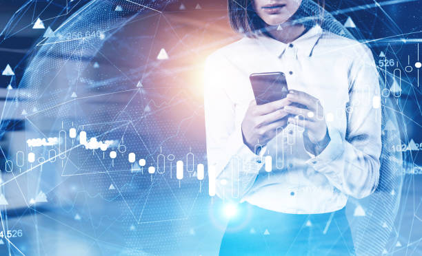 istock Woman with smartphone in office, network GUI 1216964273