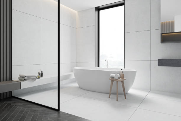 istock White tile bathroom corner with tub 1216965066