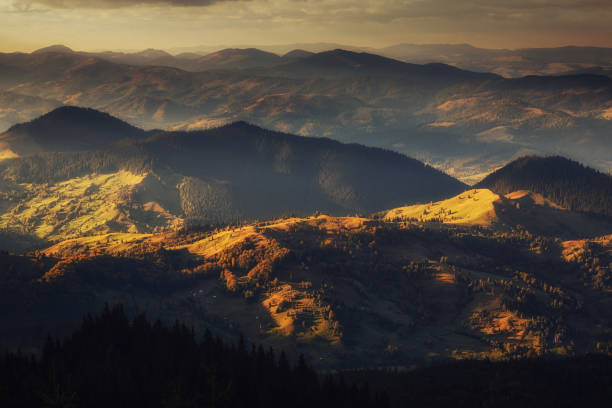 istock Mountain peaks at sunset. Panorama of mountain chain from a top view 1216965076
