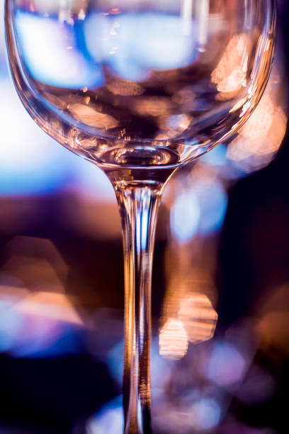 istock Wine and martini glasses in shelf above a bar rack in restaurant 1216968068