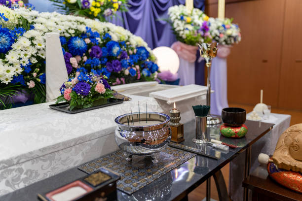 Japanese Funeral Ceremony Japanese funeral ceremony, Hitsugi(Coffin), Kouro (Censer), incense stick, Candle, Rin (Standing bell, Buddhistic bell), Rinbo (Striker). buddhist house of worship stock pictures, royalty-free photos & images