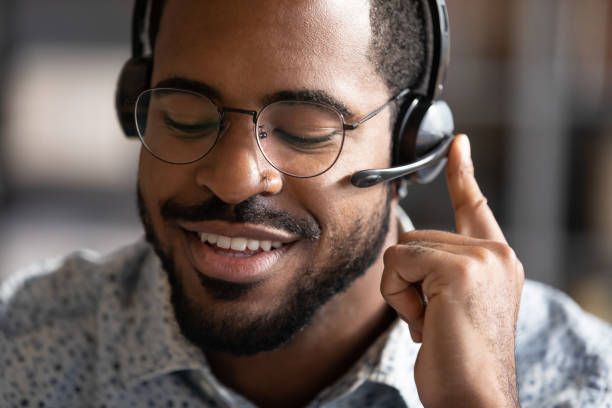 istock African american professional technical support manager consulting clients. 1216968896