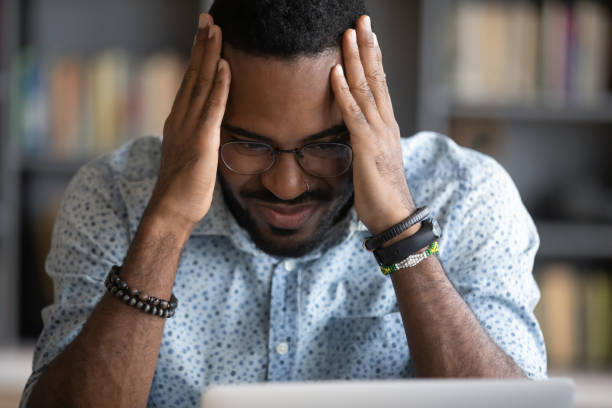 istock Depressed worried african ethnicity guy feeling anxious. 1216969439