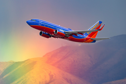 Las Vegas, Nevada, USA - May 8, 2013: Southwest Airlines Boeing 737 airliner flying past a rainbow as it departs McCarran International Airport in Las Vegas.