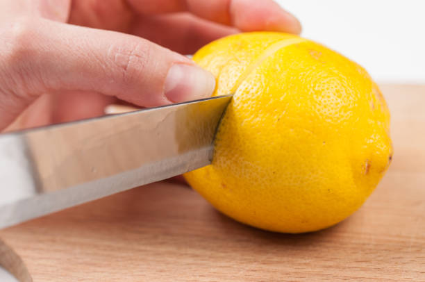 istock Lemon on cutting board isolated on white background.Copy space. 1216970917