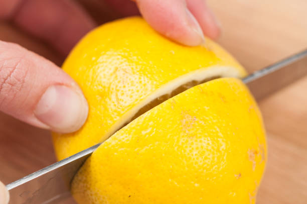 istock Lemon on cutting board isolated on white background.Copy space. 1216970945