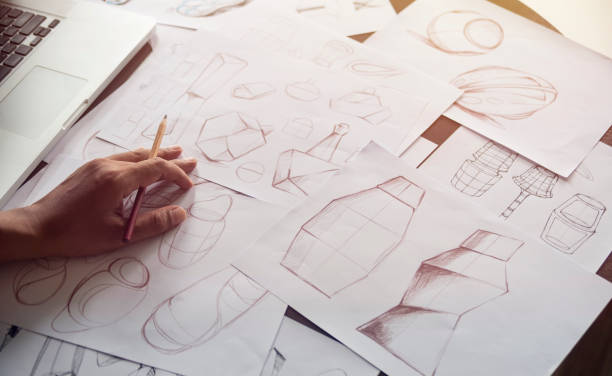 Production designer sketching Drawing Development Design product packaging prototype idea Creative Concept stock photo