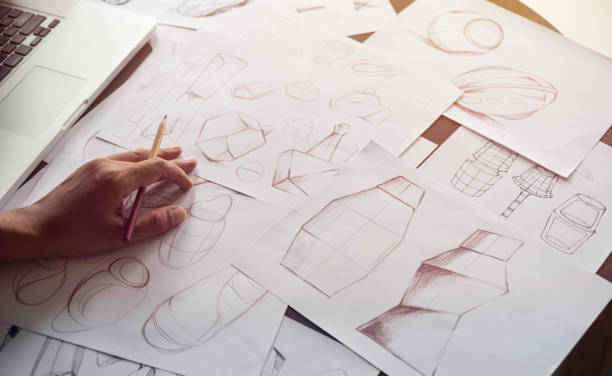 production designer sketching drawing development design product packaging prototype idea creative concept - packaging design imagens e fotografias de stock