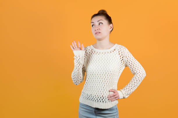istock the girl skeptically dismisses someone. Isolated 1216971494