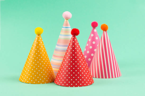istock Colorful birthday caps on mint background. 1216973946