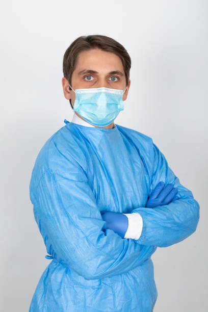 istock Young male doctor with scrubs 1216974076