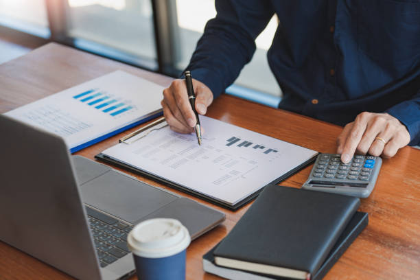istock strategy analysis concept, Businessman working financial Manager Researching Process accounting calculate analyse market graph data stock information review on the table in office 1216975956