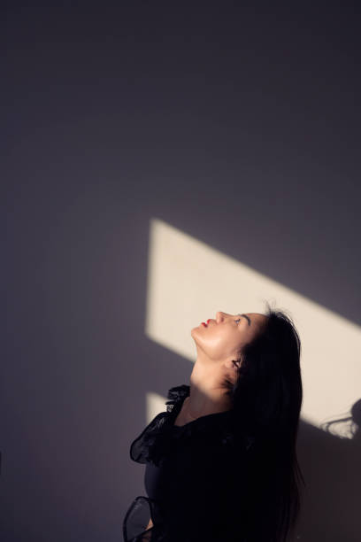istock woman face up on sunlight 1216977743