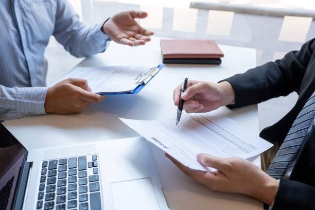 istock Job Interview and hiring concept, Appointment candidate Business man explaining about his profile and answer to Human resources manager sitting at a table opposite in the office 1216978060