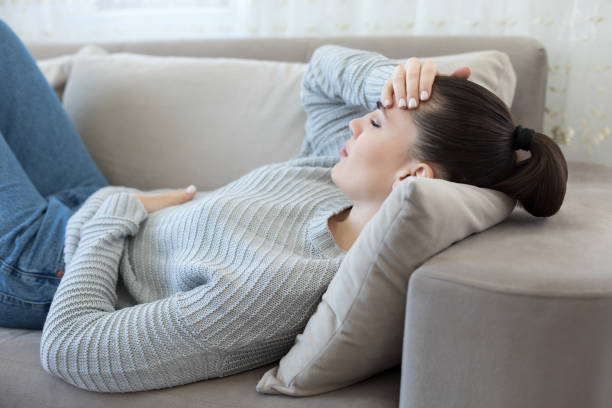 istock Young woman feeling strong headache 1216979524