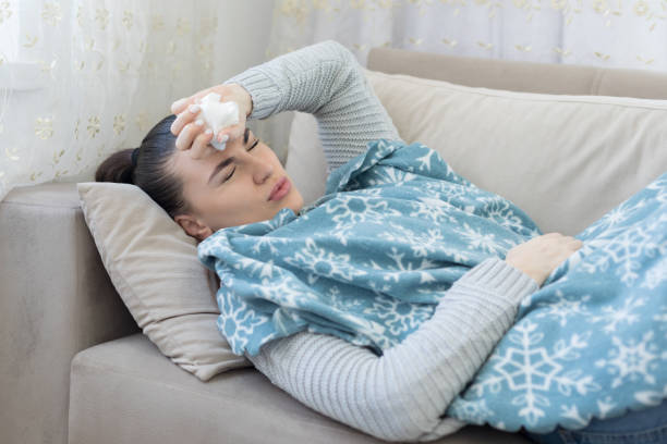 istock Woman sick at home 1216979627