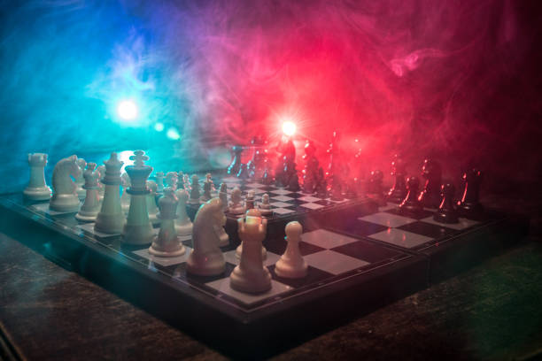 istock Chess figures on a dark background with smoke and fog. Selective focus 1216980459