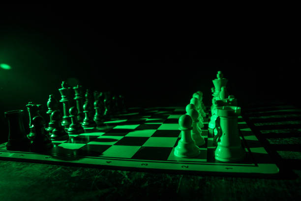 istock Chess figures on a dark background with smoke and fog. Selective focus 1216980486